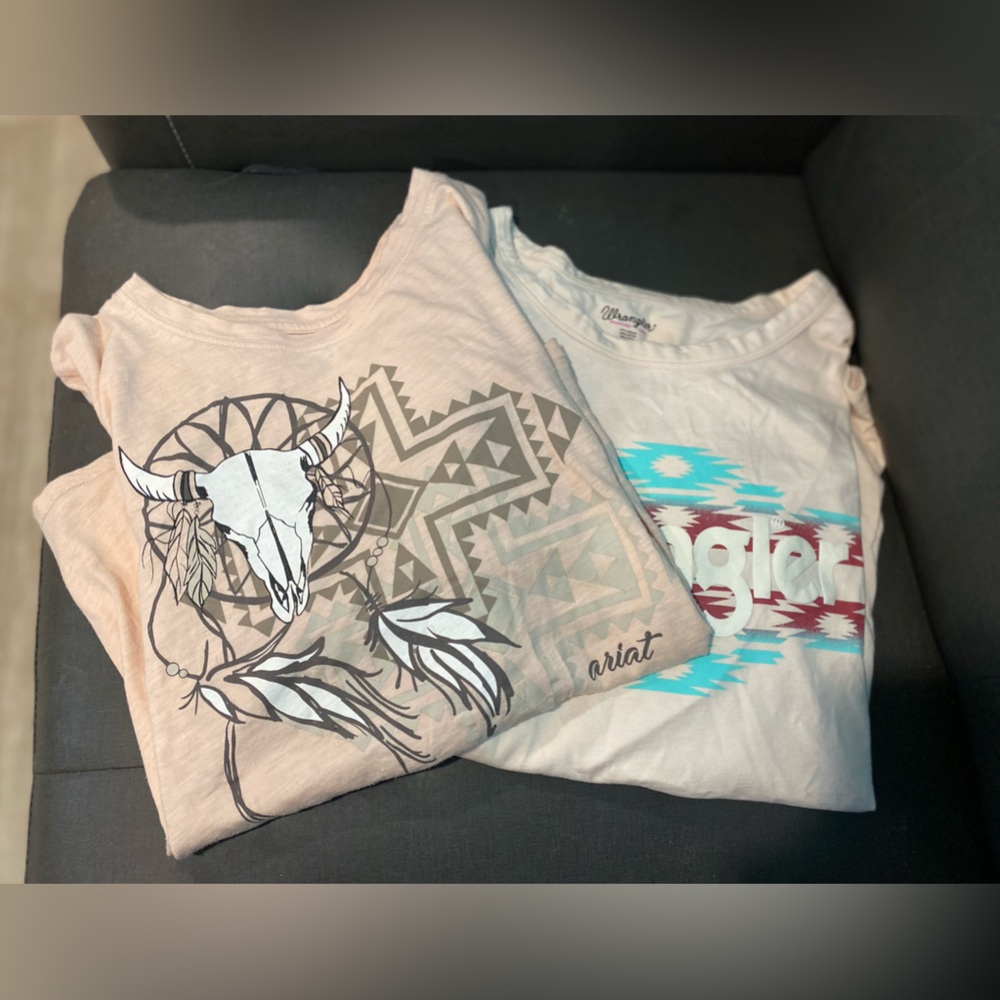 Two nice western style t shirts. Women’s large. One Wrangler and one Ariat.